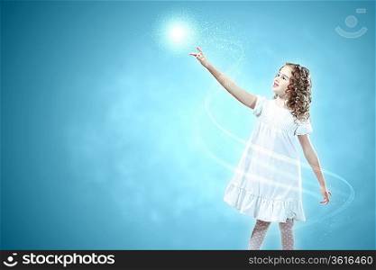 Little girl with magic lights and shining around