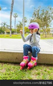 Little girl with positive attitude to skate in the park