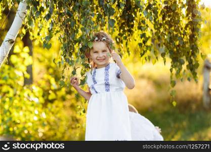 Little girl with praying. portrait of a little beautiful girl in the nature. Peace, hope, dreams concept.. Little girl with praying. Peace, hope, dreams concept. portrait of a little beautiful girl in the nature