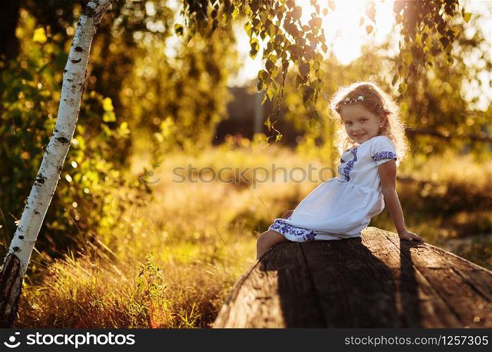 Little girl with praying. portrait of a little beautiful girl in the nature. Peace, hope, dreams concept.. Little girl with praying. Peace, hope, dreams concept. portrait of a little beautiful girl in the nature