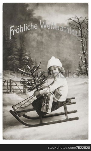 Little girl with sled and Christmas tree. Nostalgic vintage picture with original film grain and scratches