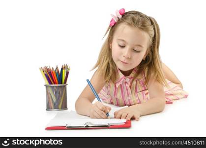 Little girl writing with pencils