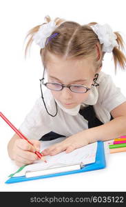 Little girl writing with pencils