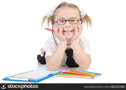 Little girl writing with pencils