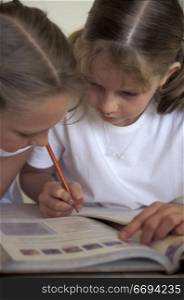 Little Girls Doing Homework Together