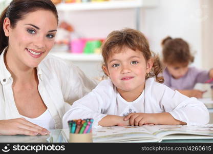 Little girls drawing in class