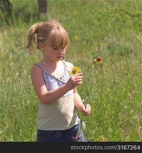 Little girls holding flowers