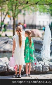 Little girls in warm day outdoor in the city. Little adorable girls in warm day outdoor in the city