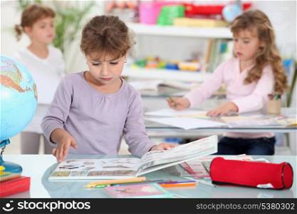 little girls studying in a classroom