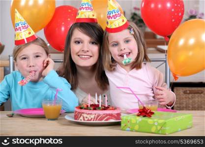 little girls with mom at birthday party