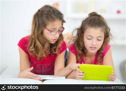 Little girls with tablet computers