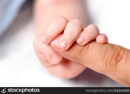 Little hand of son hold father&rsquo;s finger
