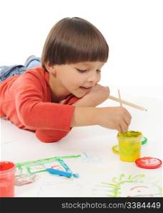 little happy boy draws paint. Isolated on white background