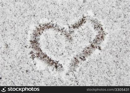 little heart drawn in fresh snow in winter