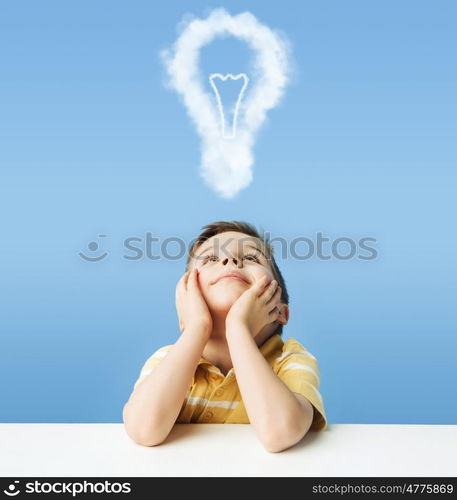 Little kid dreaming about a light bulb