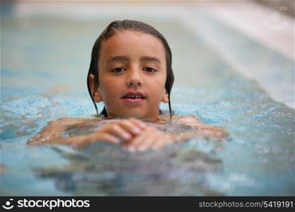 Little kid in swimming pool