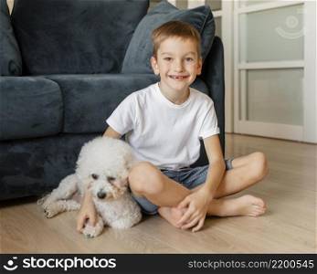 little kid posing with his dog