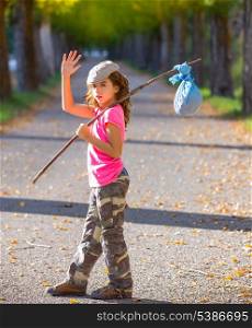 little kid with hobo stick bag and bundle girl saying goodbye with hand
