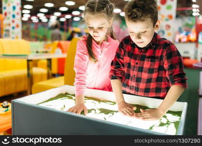 Little kids having fun on attractions in entertainment center. Happy childhood. Adventure time. Little kids having fun on attractions