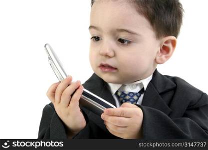 Little man discussing important business on the cell phone. Focus on eye nearest camera and hands.