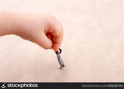 Little man figure in hand on a white background