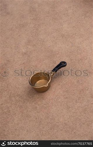 Little model pan of brown color as a kitchen utensil