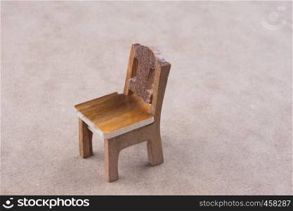 Little model wooden chair on the floor