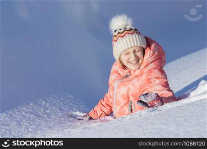 little Norwegian girl smiling. Fun winter. Norway
