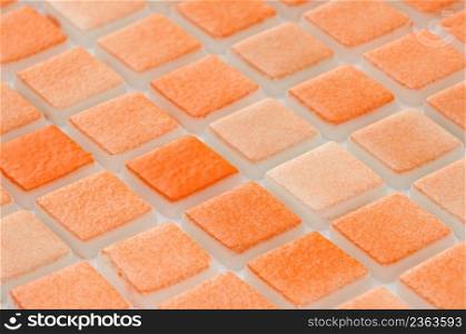 little orange ceramic tile, macro shooting, majolica. for the catalog. square small tile