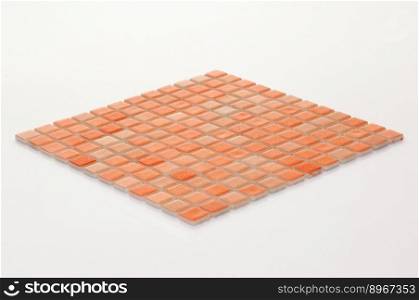little orange ceramic tile on a white background, majolica. for the catalog. square small tile