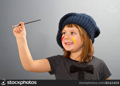 little painter girl looking isolated on grey