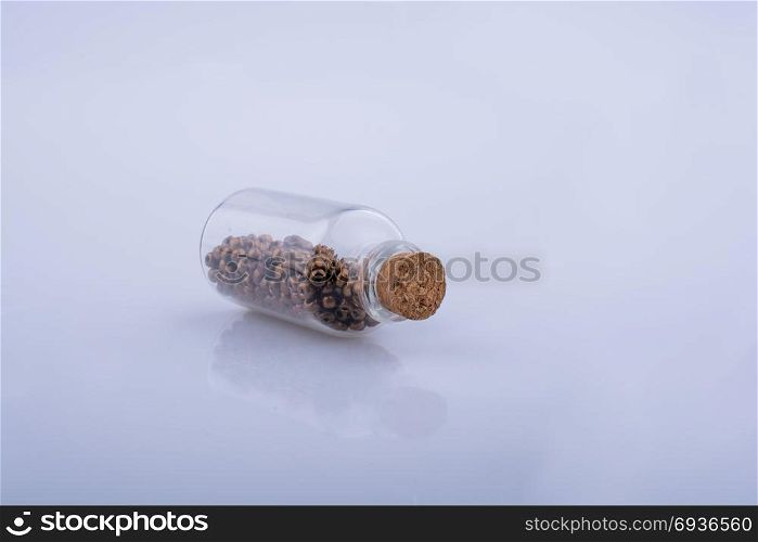 Little perfume glass bottle on a white background