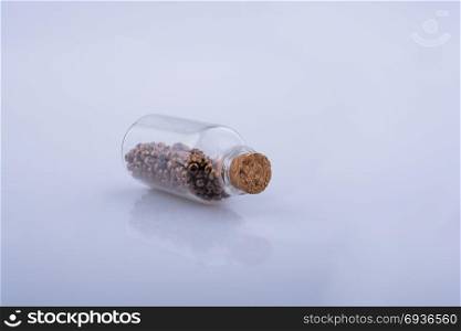 Little perfume glass bottle on a white background