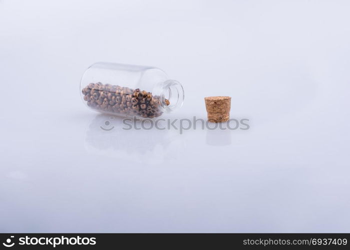 Little perfume glass bottle on a white background