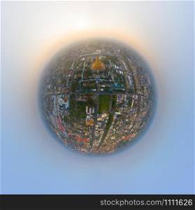 Little planet 360 degree sphere. Panorama of aerial top view of Phra Pathommachedi temple at sunset. The golden buddhist pagoda, urban city of Nakorn Pathom, Thailand. Thai architecture.