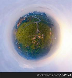 Little planet 360 degree sphere. Panorama of aerial top view of Samet Nangshe and tropical green forest trees at sunset with Andaman sea in Phang Nga Bay in summer, Thailand. Natural landscape.