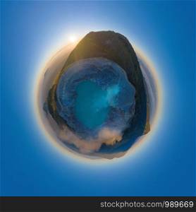 Little planet 360 degree sphere. Panorama of Aerial view of Kawah Ijen volcano with turquoise sulfur water lake at sunrise. Panoramic view at East Java, Indonesia. Natural landscape background.