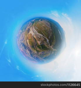 Little planet 360 degree sphere. Panorama of aerial view of machine excavator trucks dig coal mining or ore in quarry with mountain hills. Nature landscape background in factory industry. Environment