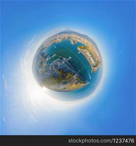 Little planet 360 degree sphere. Panorama of aerial view of Mountain Fuji near industrial area, factory, Japanese port and harbour in Shizuoka City at sunset, Japan. Natural landscape background.