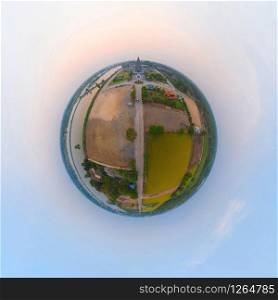 Little planet 360 degree sphere. Panorama of aerial view of Wat Panyanantaram at sunset, a Buddhist temple in Pathum Thani City, Thailand. Thai architecture buildings. Buddhism religion.
