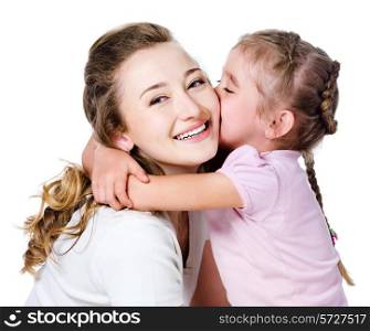 Little pretty daughter kissing and embracing her happy mother
