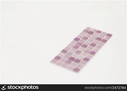 little purple ceramic tile on a white background, majolica. for the catalog. square small tile
