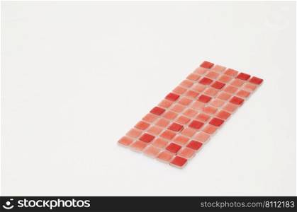 little red ceramic tile on a white background, majolica. for the catalog. square small tile