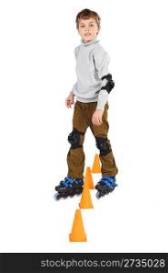 little roller boy clears obstacles orange cones looking at camera isolated on white