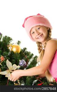 Little santa girl decorating the christmas tree