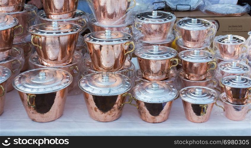 Little set of buckets of made of metal in a market place