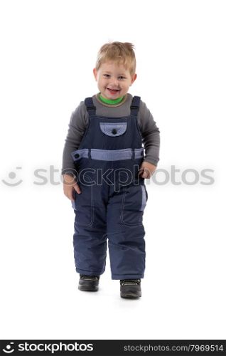 Little smiling boy 3 years winter pants in the studio. Isolate on white background.