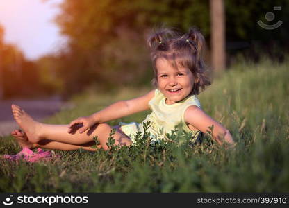 little smiling girl at the garden