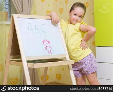 Little smiling girl with white board