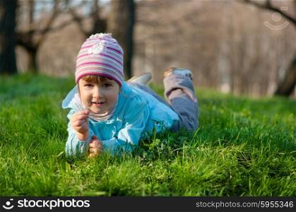 Little smiling little girl at spring forest